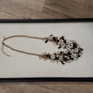 Natasha design with Black beads and White flowers and pearls.
